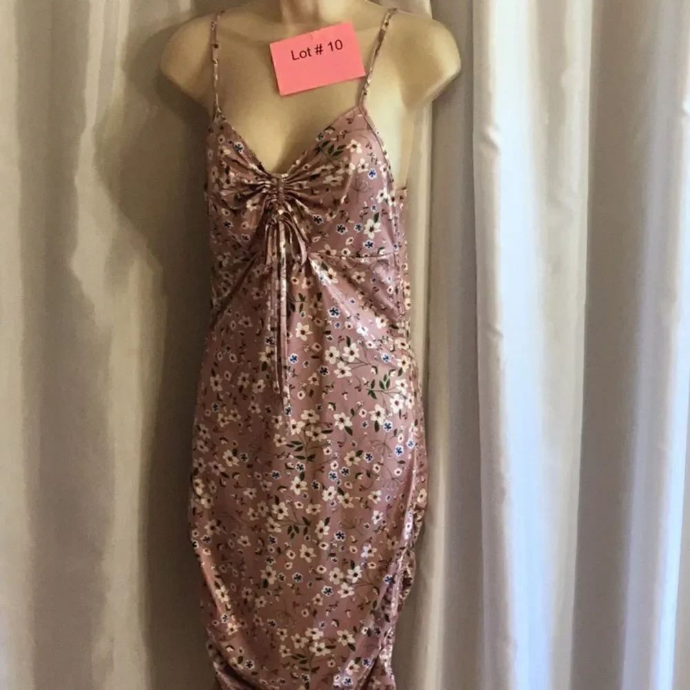 Bodycon dress in medium with tie adjustments at bust, on hips for length